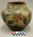 Pottery olla. Globular, red base, brown and red design on cream slip