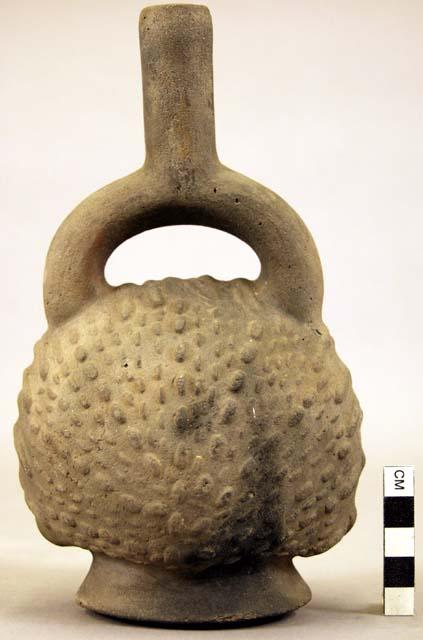 Pottery jar mouth in center of cross handle, stamped