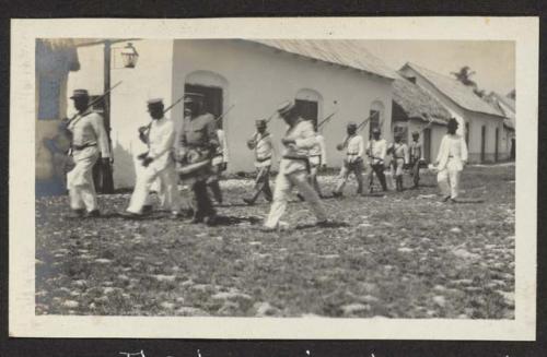 The town crier, drummer, and escort, Flores