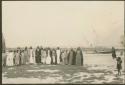 Group portrait of men and children with river in the background Marsh Arab Iraq