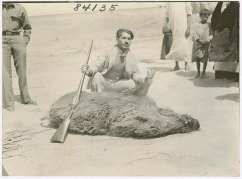 Marsh Arab man with dead wild pig