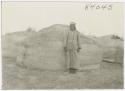 Portrait of man next to house Marsh Arab Iraq