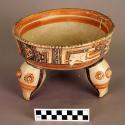 Large polychrome tripod pottery bowl