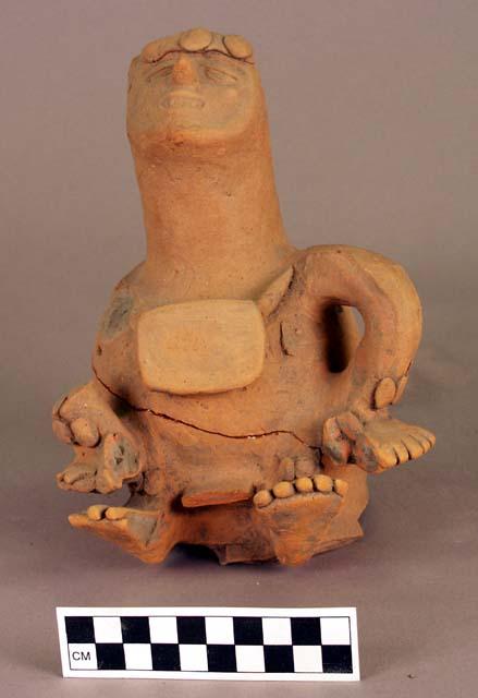 Figure of a cripple in terracotta