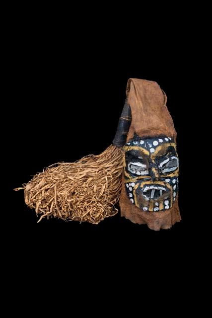 Painted pitch mask on bark cloth rope and feather trim