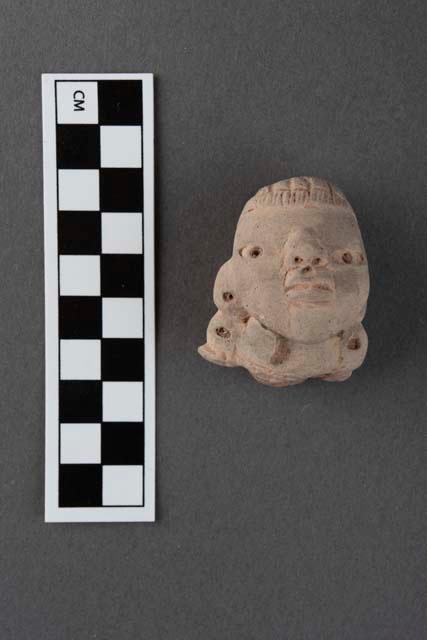 Fragmentary pottery figure- Archaic type