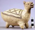 Pottery figure of llamita- short legged, full bodied with painted striped on bac