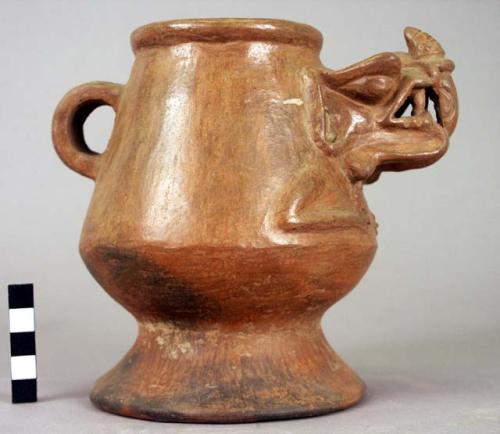 Pottery pedestalled effigy vessel - brown; ribbon handle with incising