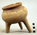 1 tripod pottery vessel with two legs broken
