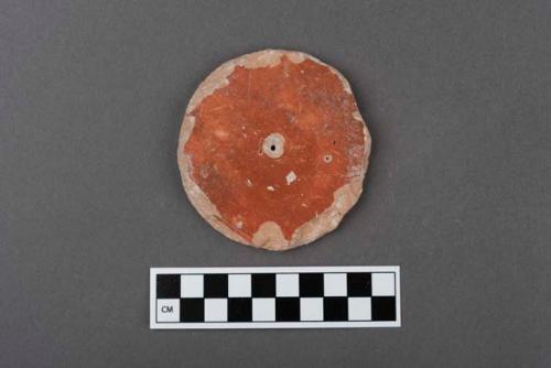 Perforated potsherd disc