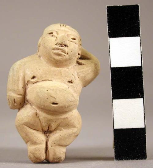 Small pottery figurine: Female baby: buff clay with buff slip.