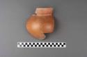 One-fourth of medium-sized pottery olla - orange brown