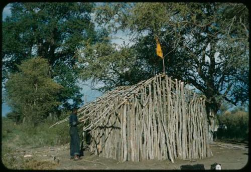 Expedition member standing next to a cookhouse