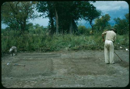 Wilhelm Camm clearing a garden