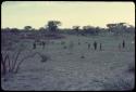 Group of people walking, distant view