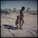 Children, "Fathers and Sons": /Gaishay holding his sister's (!Ungka Norna) hand, walking toward a waterhole (copy of slide 9B-69)