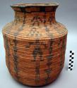 Rod coiled jar, olla shaped. Wide shoulder. Neck almost perpendic
