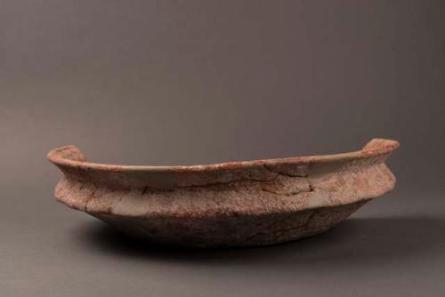 Flat pottery dish with low rim, fragment