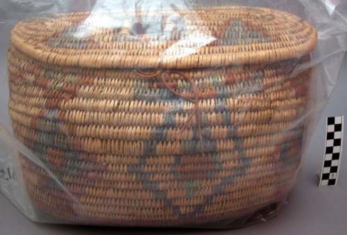 Oval utility basket with attached lid. Coil technique. Made of bear grass. Ge