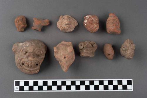 10 pottery animal figurine heads