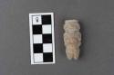 Small rude stone effigy of human figure