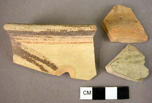 1 rim sherd, 2 potsherds, curvilinear design