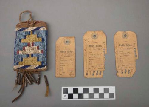 Crow beaded ration card case w/ 3 ration cards. Leather w/ beadwork & fringe