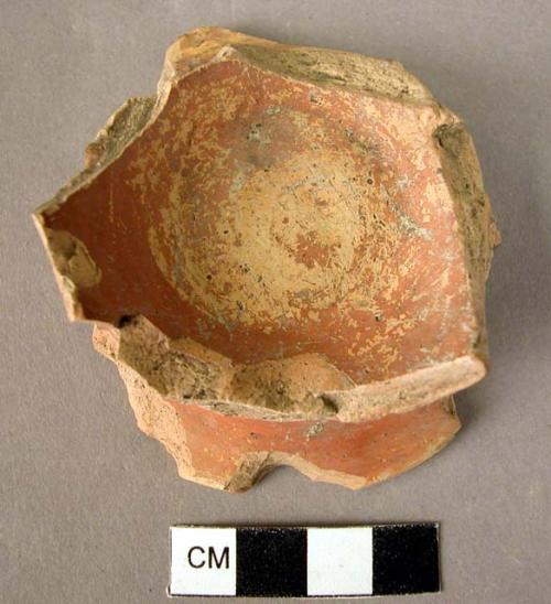 Red, glazed pottery foot