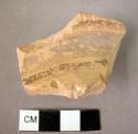 Pottery shoulder sherd - matt paint on polished yellow buff