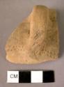 Small handled pottery cup fragment with impressed dots