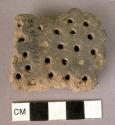 Fragment of sieve vessel or of fire-glow guard (?)