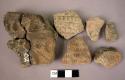 Ceramic rim & body sherds, red, finger pinched, stamped cardial des, mended