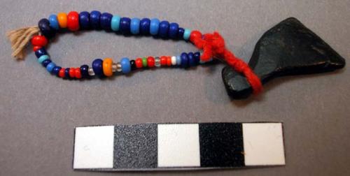 String of beads and bird amulet