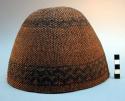 Twined basketry hat. 2 bands of design. Band by rim of cap