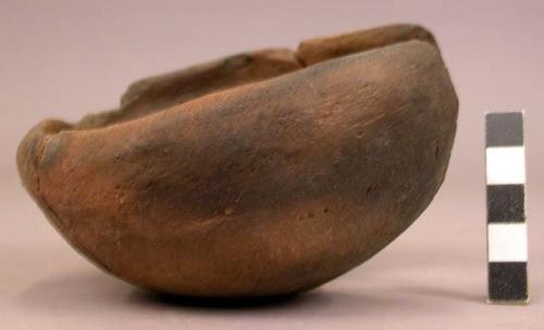 Partially restored small pottery bowl