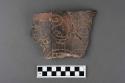 Incised dark potsherds