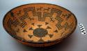 Medium-sized tray basket, coiled.  Made of bear grass and devil's claw.