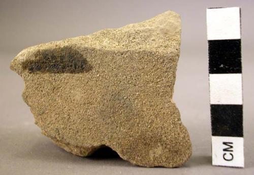 Fragment of sandstone polishing stone