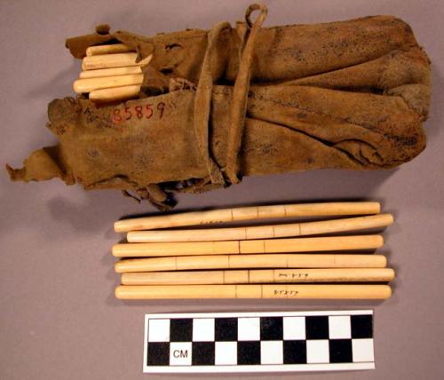 Caribou case and gambling sticks, bone