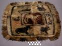Sealskin rug with animals sewn on it (17 1/4" long x 13" wide)