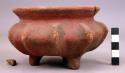 Vessel, with three legs.  Incised decoration.