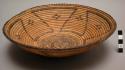 Small tray basket, coiled. Geometric designs.