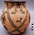 Small, jar-style basket. Made of bear grass and devil's claw.