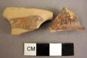 2 painted Mycenaean handle fragments