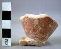 Red glazed footed pottery cup base