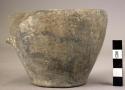 Undecorated pottery cup with handle