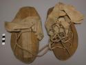 Pair of Plains moccasins, probably Omaha. Rawhide soles. Leather uppers