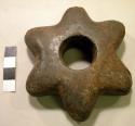 Stone, ground stone, star-shaped, perforated center, broken