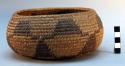Bundle coiled basket, possibly Great Basin. Bowl shaped. Self coiled rim finish.