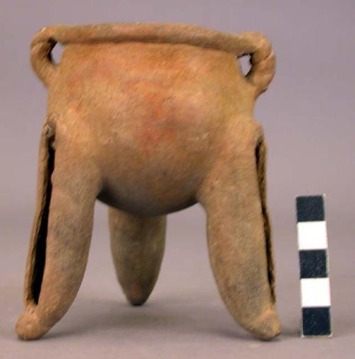 Pottery dish, tripod, legs hollow with clay balls